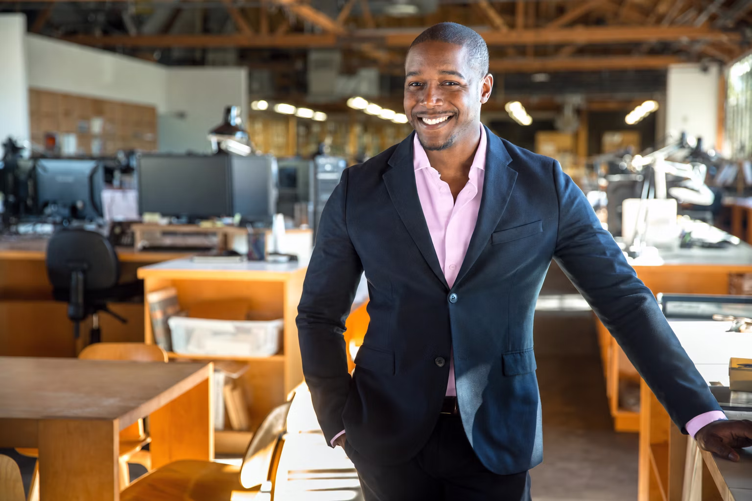 A graduate in a workplace.