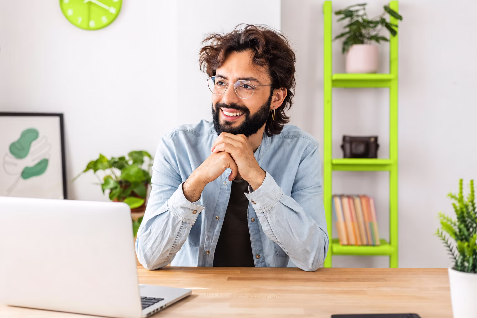 A student smiling at a laptop, ready to apply.