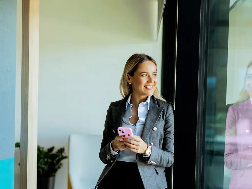 A professional reading her results on her phone.